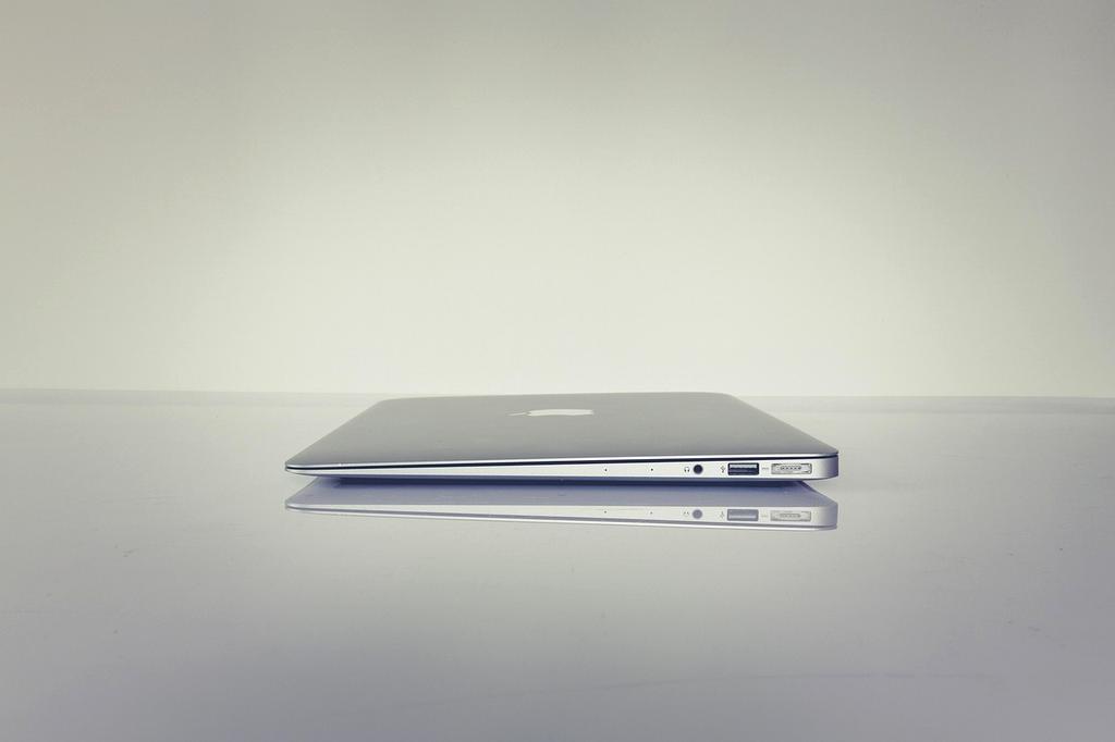 Professional cleaner sanitizing an office desk